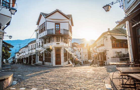 Clock tower in the castle in Gjirokaster, Albania. Souvenir shops in old town of Gjirokaster in Albania.