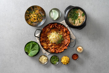 Fototapeta na wymiar Korean food dish Grilled pork kimchi, potato pancake, egg roll, kimchi roll noodles, bibim noodles, side dishes