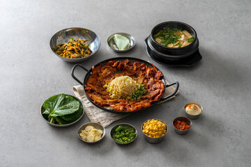 Korean food dish Grilled pork kimchi, potato pancake, egg roll, kimchi roll noodles, bibim noodles, side dishes