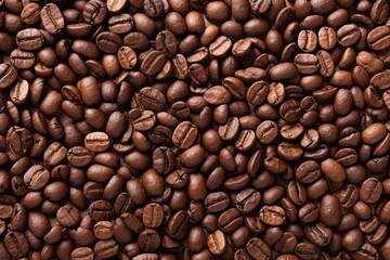 Obraz premium Roasted Coffee beans background, texture and copy spase, top view.
