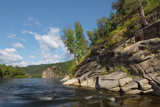 Russia. Chita region. Coastal rocks on the Burkal River, whose fast waters tend to the Selenga River and further into Lake Baikal.