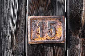 Wood texture planks with old digit 15. Texture, background, old materials.