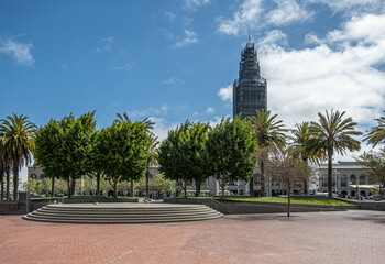 San Francisco, CA, USA - July 12, 2023: embarcadero plaza with green section in front of Ferry...