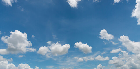 amazing. Blue sky and white clouds float in the sky on a clear day with warm sunlight. Mixed with...