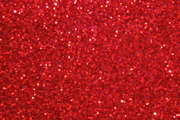 Pink defocused glitter texture as background

