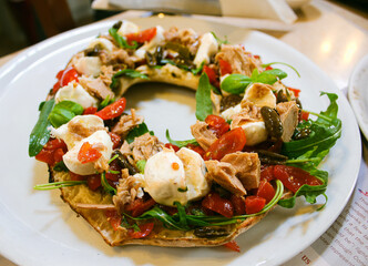 Napolitan pizza with tuna and fresh mozzarella Italian style