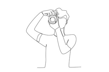 A man zooms the camera. World photography day one-line drawing