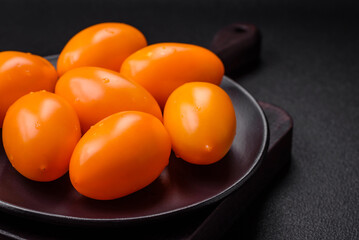 Bright juicy fresh yellow plum-shaped tomatoes. Preparing the tomato sauce