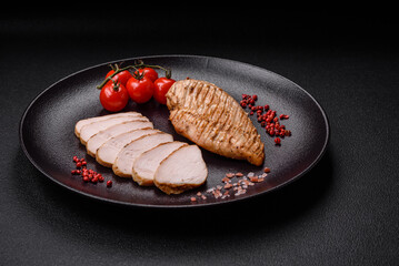 Delicious juicy grilled chicken fillet with salt, spices and herbs