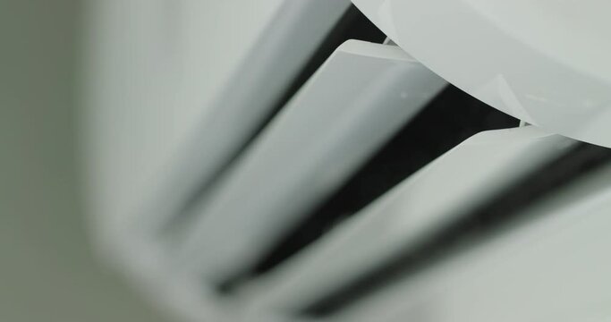 Air conditioner operation, flow louvers move up and down, distributing the air flow