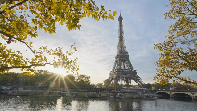 Beautiful view of famous Eiffel Tower one of the most iconic landmarks in France. Paris city center and river Seine at morning sunrise or sunset in autumn. Best travel destinations landmark in Europe.