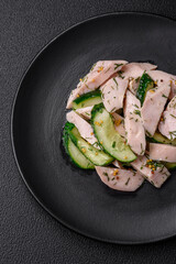 Delicious juicy fresh salad of cucumbers and grilled chicken slices, with french mustard