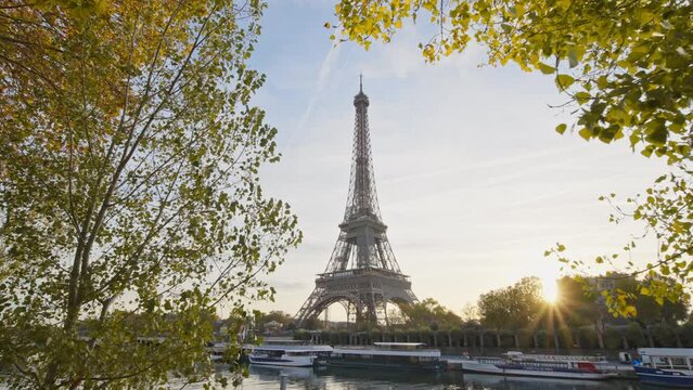 Beautiful view of famous Eiffel Tower one of the most iconic landmarks in France. Paris city center and river Seine at morning sunrise or sunset in autumn. Best travel destinations landmark in Europe.