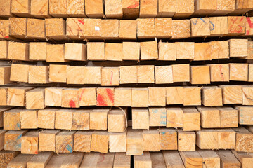 Wooden stacked in a warehouse, close-up. Wooden industrial background