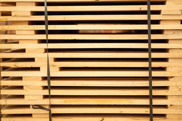 Wooden stacked in a warehouse, close-up. Wooden industrial background