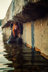 Girl dressed as a pilot in the water summer 2023