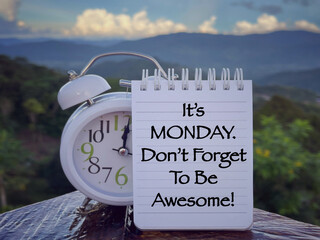 Motivational and inspirational wording. It’s Monday Don’t Forget To Be Awesome written on a notepad. With blurred styled background.