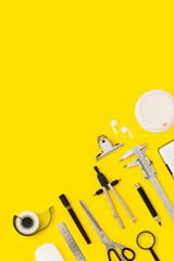 Stationary flat lay on yellow background