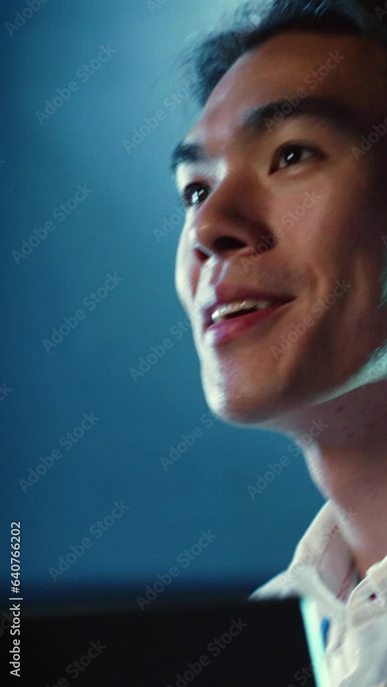 Poster vertical video close up shot of happy employee wandering around data center infrastructure providing