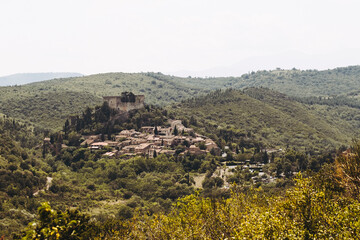 Fototapeta na wymiar Castelnou, 26 juin 2023, France - Panorama sur le village ancien de Castelnou dans le sud de la France