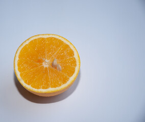 Ripe orange cross-section. Close-up. Isolated. White background.
