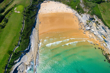 Aerial view above the coast of Santander Spain's beaches and Golf course during summer - obrazy, fototapety, plakaty
