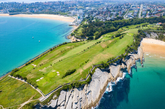 Aerial view above the coast of Santander Spain's beaches and Golf course during summer