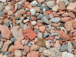 cobblestone floor background with rounded stones of different shapes. Perspective view of Texture of stones and cobblestones.