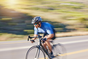 Motion blur, fitness and cyclist on bike on road in mountain with helmet, exercise adventure trail and speed. Cycling race, nature and man with bicycle for fast workout, training motivation or energy