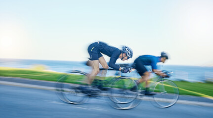 Motion blur, competition and cyclist on bicycle on road in nature with helmet, exercise adventure...