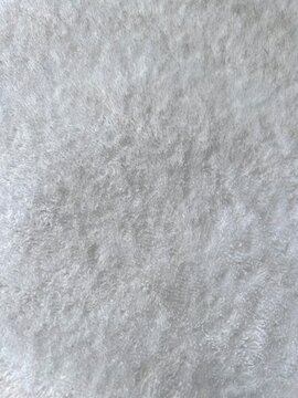 Fur cloth. Gray fluffy textile surface, fur fabric. Grey fur. Abstract fabric background. Gray warm cloth concept for background. Fluffy texture. Grey carpet texture. High quality photos