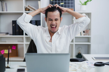 The overworked businessman or manager, grapples with frustration and anger in the office. A...