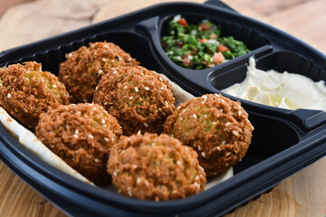 Falafel or felalfel, felafel And Tabbouleh salad or Tabulah And Humus served in dish isolated on wooden table top view middle eastern breakfast food