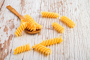 Wooden spoon with Italian pasta