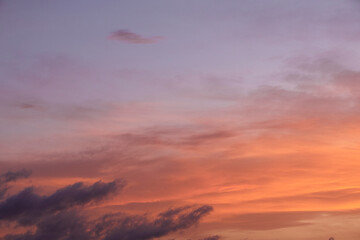 Obraz premium Sky light after sunset. orange background, clouds