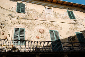 Asciano, Tuscany - Facade of an old medieval house - 640784032