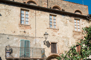 Asciano, Tuscany - Facade of an old medieval house - 640784206