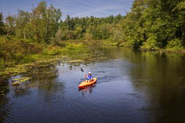 Kayaking on the Bantam River at the White Memorial Foundation nature preserve in Litchfield,...