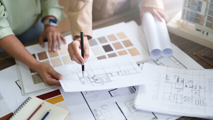 Interior architect working with blueprint planning in modern office, engineering concept.  - obrazy, fototapety, plakaty