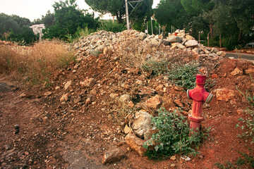 Photo of old fire extinguishing equipment in open area.