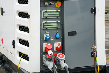 A fragment of a connected large mobile diesel charging generator control panel