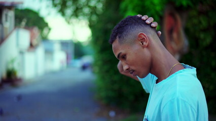 One thoughtful Black Brazilian man walking in street brooding decision. Contemplative African American descent person walks forward pondering dilemma