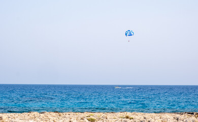 Tourist people parasailing in the sea. Summer  entertainment holidays, extreme sports outdoor