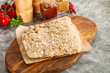 Breaded raw breaded meat schnitzel