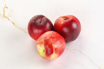 Ripe sweet juicy nectarines heap