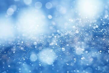 Obraz na płótnie Canvas Abstract snow bokeh texture on blue background