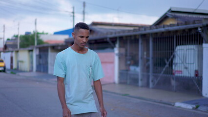 One Black Brazilian Man Walking on Street with contemplative thoughtful expression, Deeply Pondering a Difficult Decision