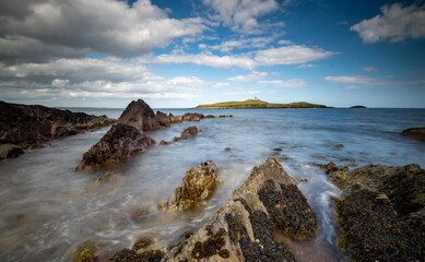 Bellycotton rocky coastline with lighthouse for marine safety  in Ireland.