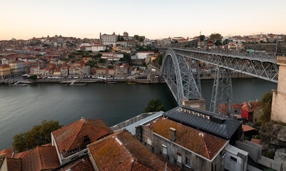 Fototapeta na wymiar Cityscape of porto Portugal. Ponte de dom luis bridge at sunset. Douro river