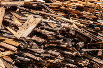 a pile of discarded wooden boards
